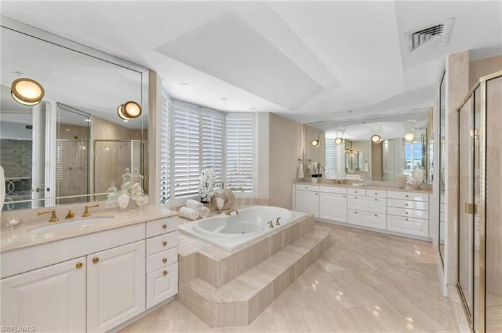 Huge primary bath has double vanities, two water closets, a bidet, and after a long day on the tennis courts...a bath sounds relaxing!