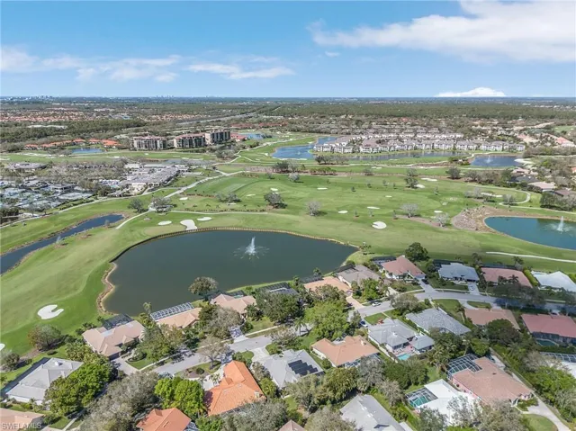 View of property location featuring a large body of water and nearby suburban area