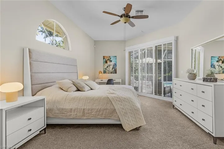 Bedroom featuring light colored carpet, access to outside, and ceiling fan