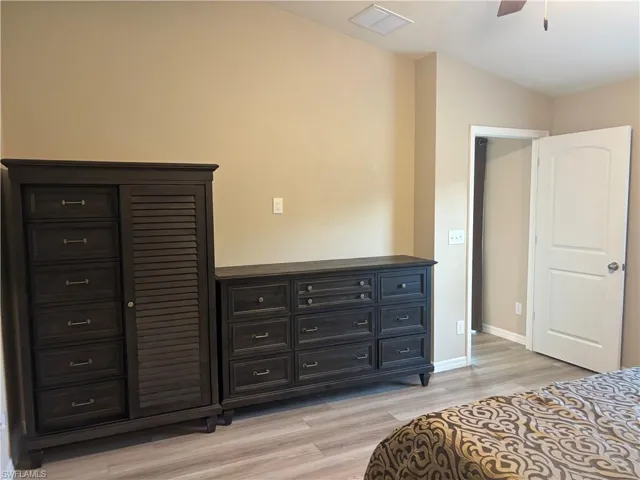Bedroom featuring light wood finished floors and ceiling fan