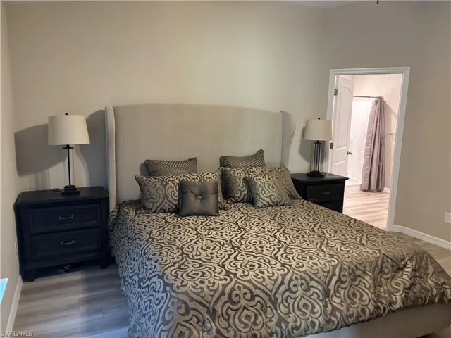 Bedroom featuring baseboards and light wood-style floors