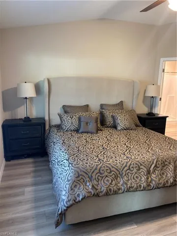 Bedroom featuring light wood-type flooring and ceiling fan