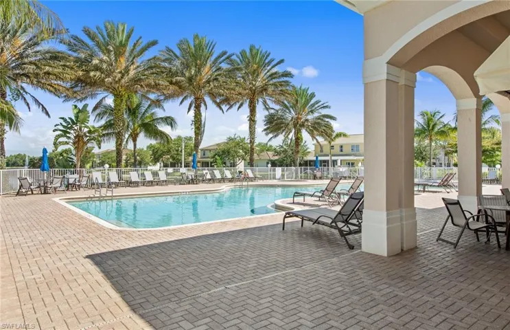 Community pool with a patio area