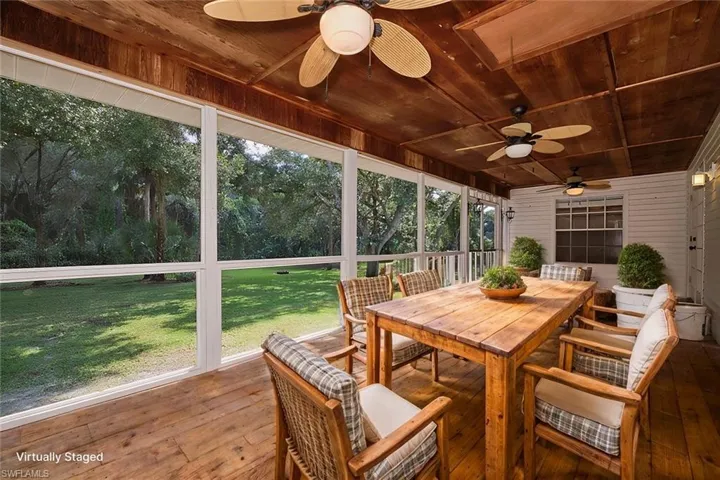 Sunroom / solarium with wood ceiling and ceiling fan