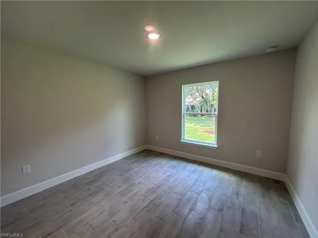2nd Bedroom with Wood Look Tiled Flooring