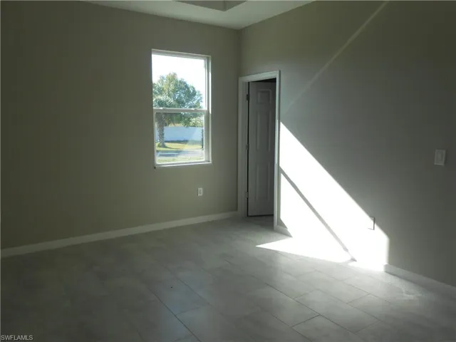 Empty room with baseboards