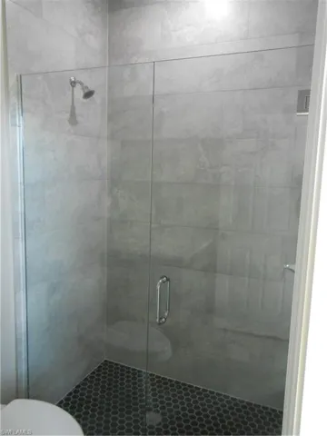 Full bath with tiled shower