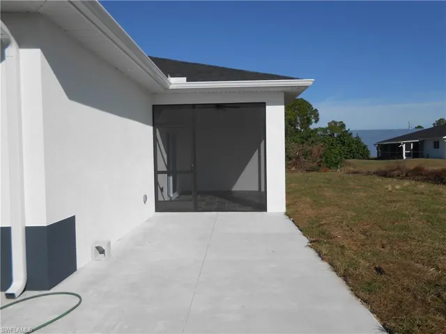 View of patio featuring a sunroom