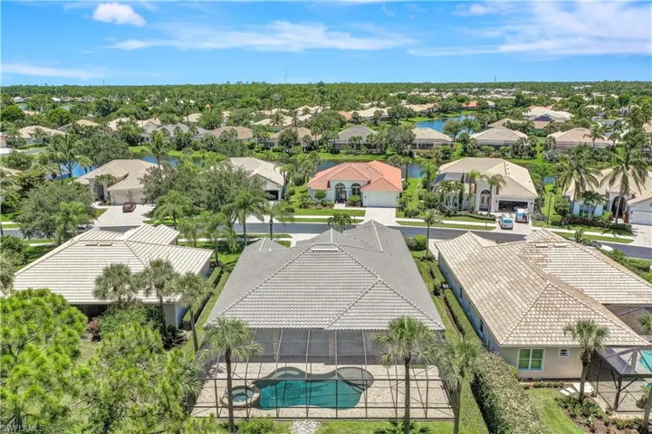 View of back of the home from drone / aerial view