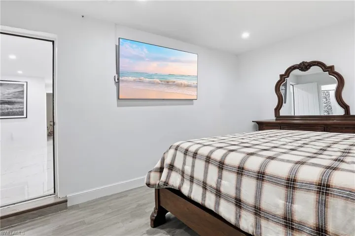 Bedroom with recessed lighting and light wood-style floors