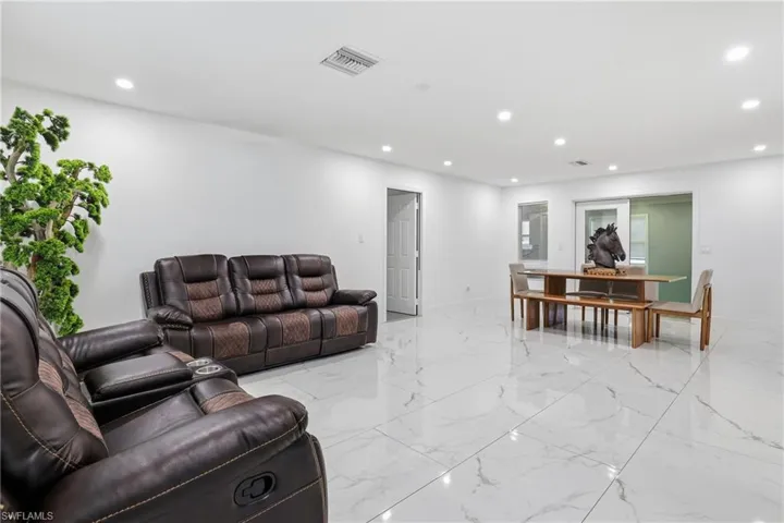 Living room featuring recessed lighting and baseboards