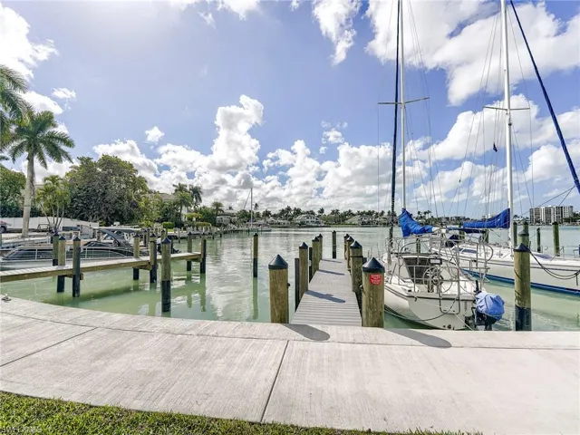 Dock area featuring a water view