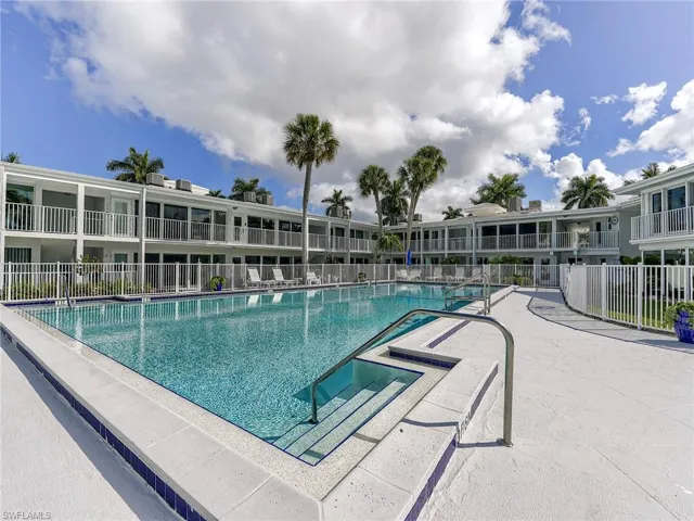 Community pool featuring a patio