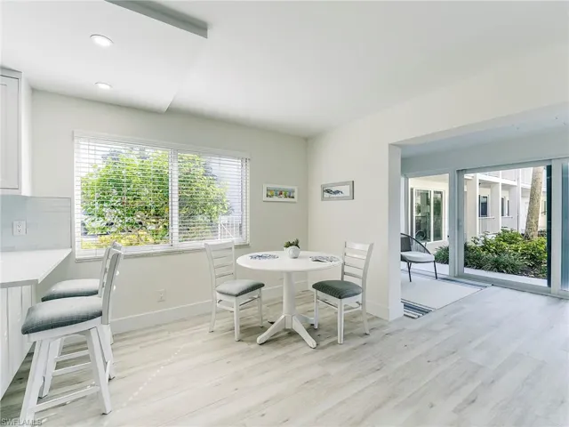 Dining space featuring light wood-style flooring and recessed lighting