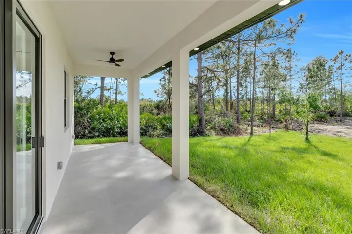 View of patio featuring a ceiling fan