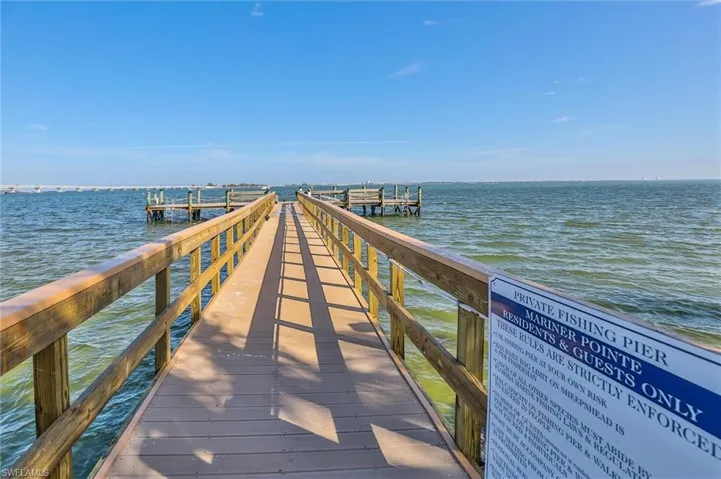 Dock area featuring a water view