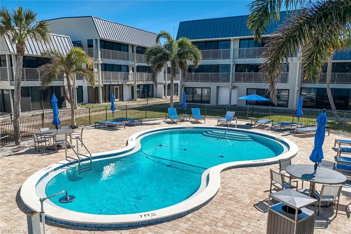 Community pool with a patio