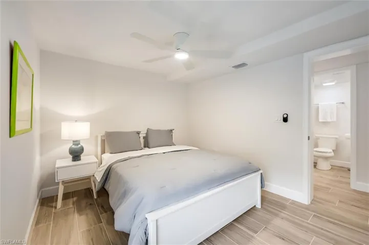 Bedroom with light wood-style flooring and a ceiling fan