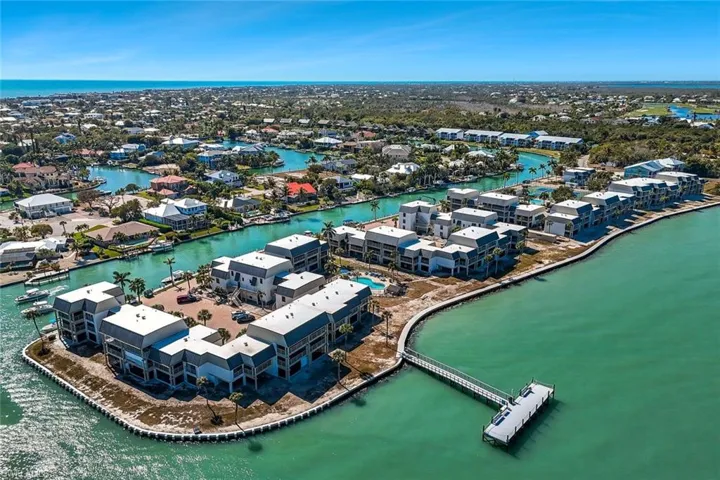 Aerial overview of property's location with a large body of water