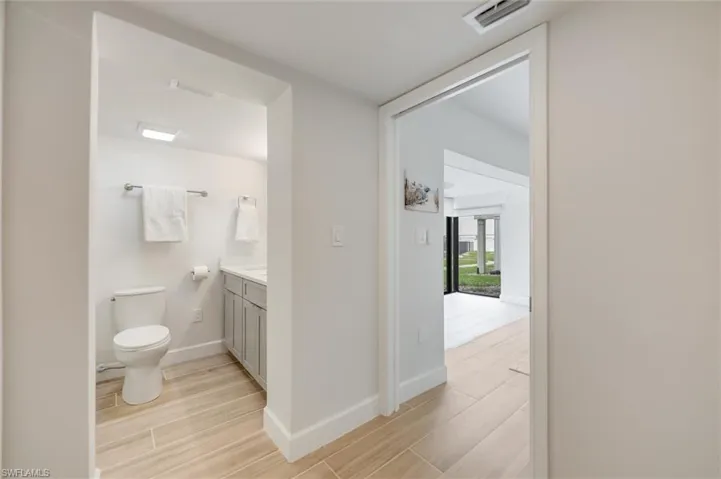 Bathroom with vanity and wood finished floors