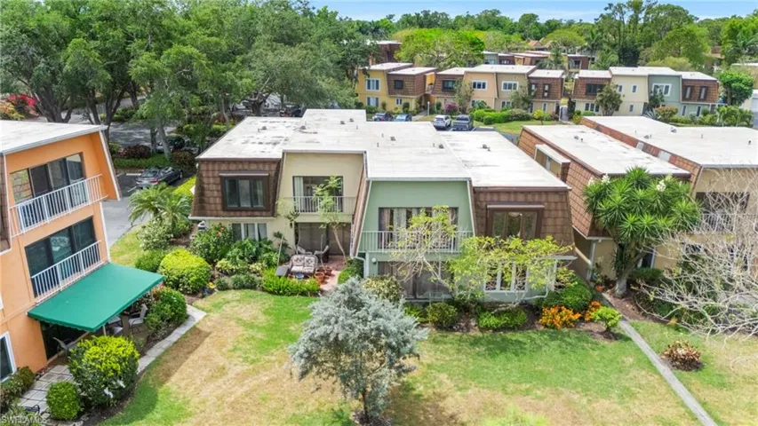 Rear view of house featuring a residential view and stucco siding