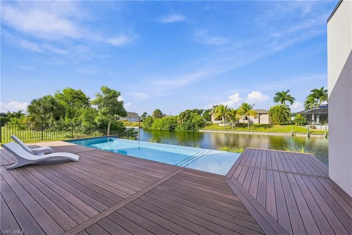 NewTechWood Brazilian Ipe-inspired composite decking and spectacular waterfront setting with an infinity-edge pool