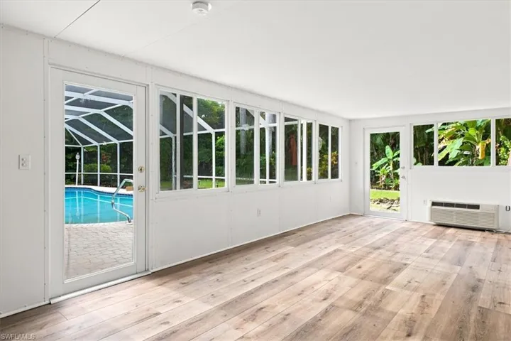 Extra AC'd space off of primary suite and door to pool area