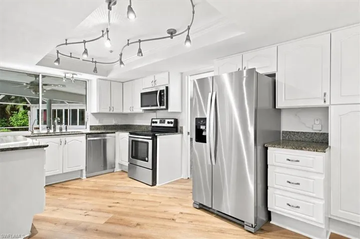 Real wood cabinets.  Appliances is good condition