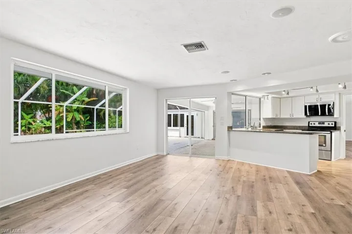 2nd large space off of kitchen.  Also with slider to pool area