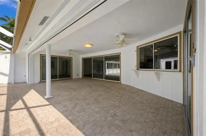 Large under truss area with electric storm shutter