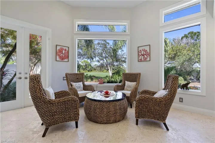 Living area with french doors and baseboards