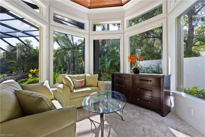 Sunroom featuring carpet floors