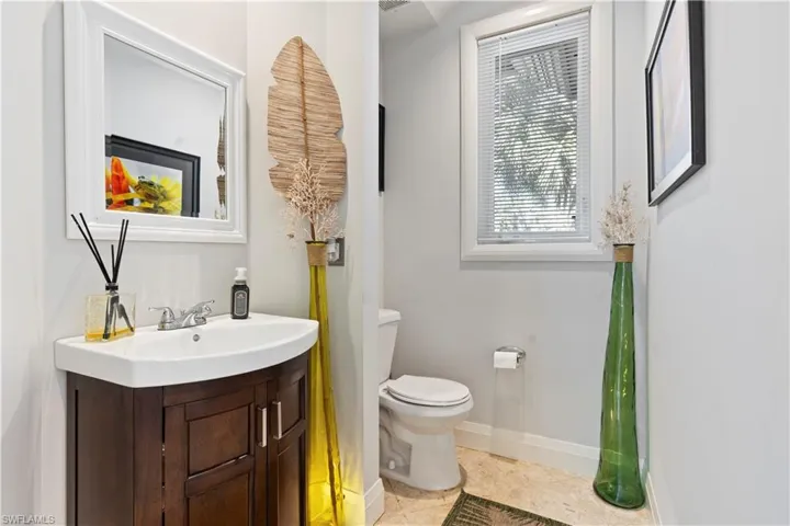 Bathroom with vanity and baseboards