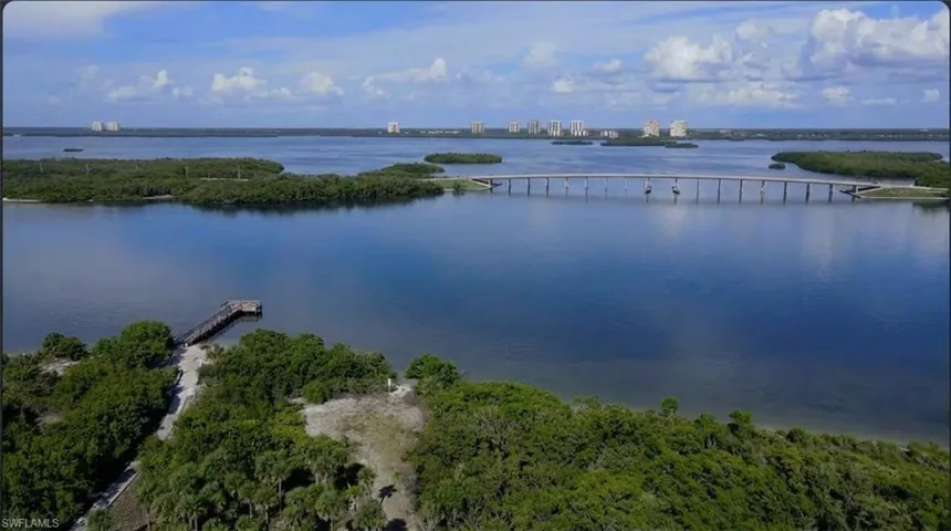 Water view featuring a notable bridge and nearby urban area