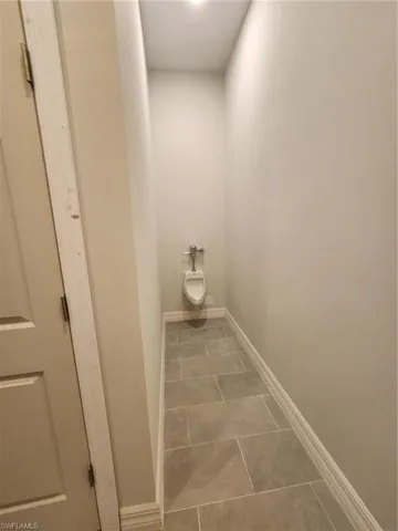 Bathroom with tile flooring