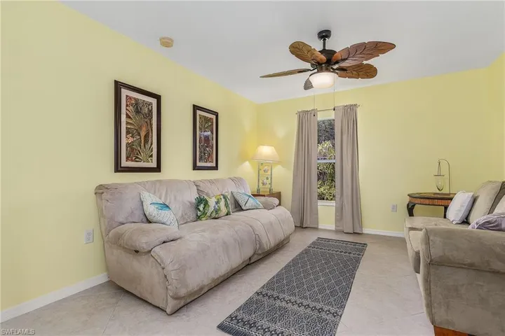 Tiled living room with ceiling fan