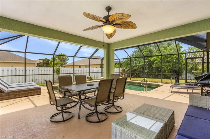 Sunroom featuring ceiling fan