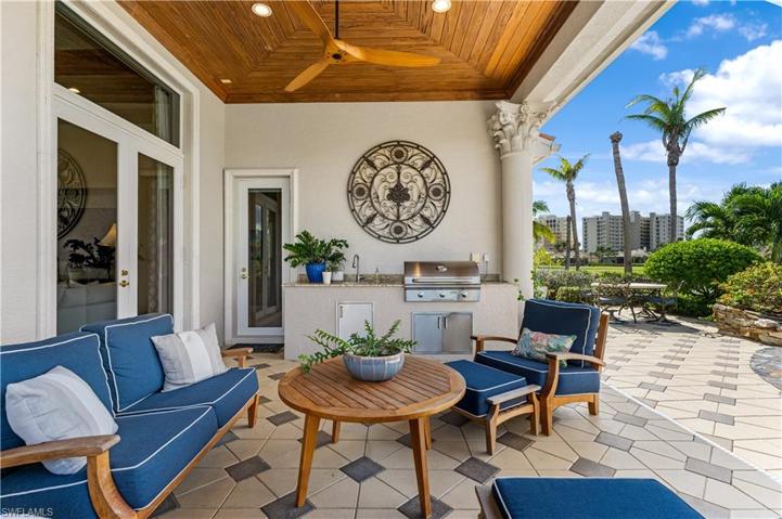 Pecky Cypress wood ceiling on your lanai with a outdoor kitchen with AOG (American outdoor grill), sink. Pavered pattern deck.