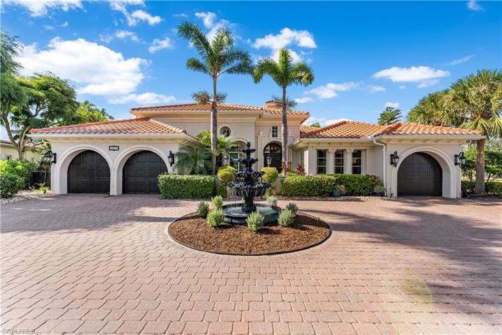 Private pavered driveway w/ water fountain & 3 car garage