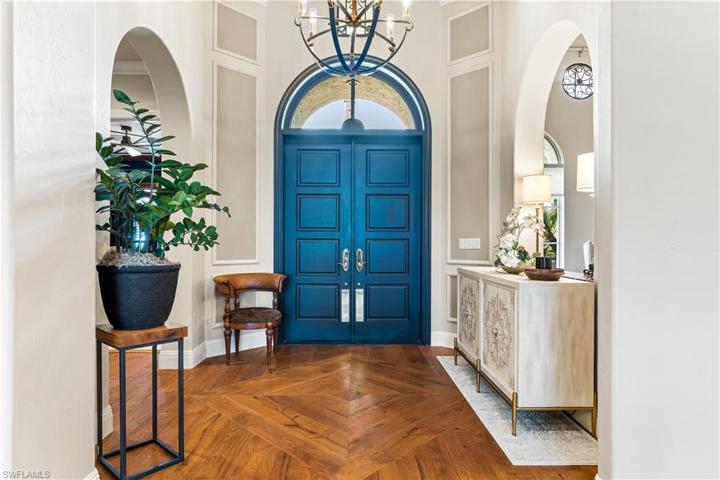 De Chateau Wood Flooring, Solid Core 8 ft.solid Wood Doors, 20ft Double Trey Coffered Ceiling. Custom unique lighting.
