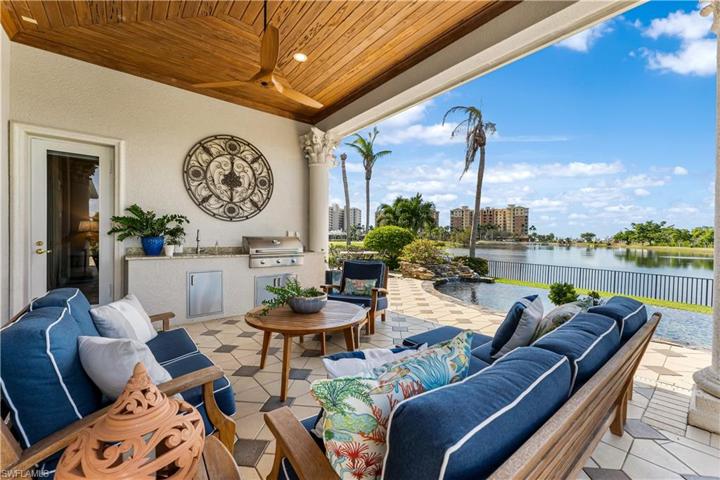 Pecky Cypress wood ceiling on your lanai with a outdoor kitchen with AOG (American outdoor grill), sink. Pavered pattern deck.