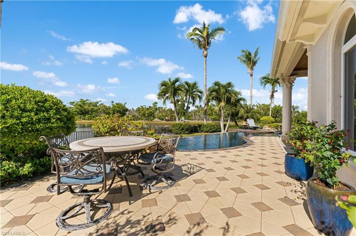 Pavered pattern deck, Sitting area with lake and pool views.