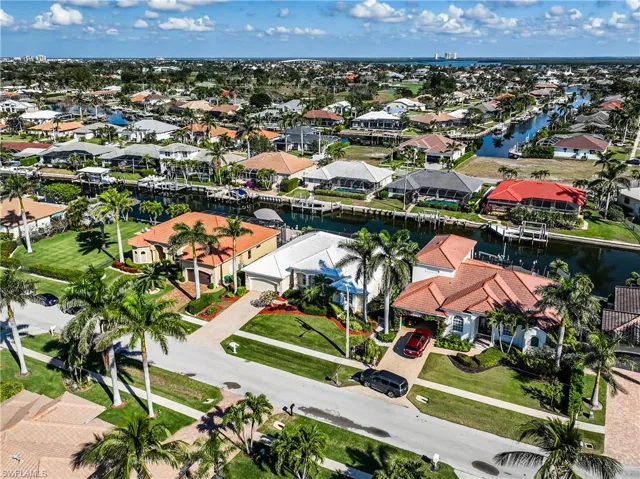 Birds eye view of property featuring a water view and a residential view