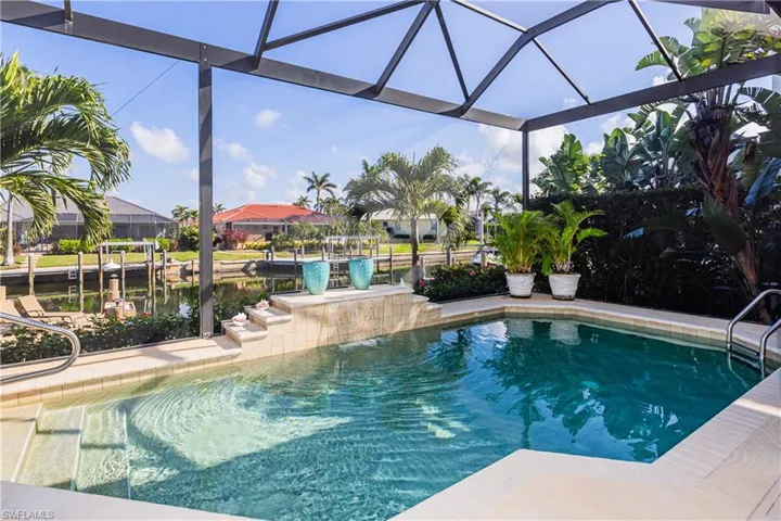 Outdoor pool with glass enclosure