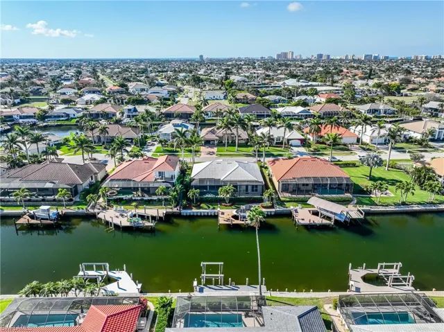 Drone / aerial view featuring a residential view and a water view