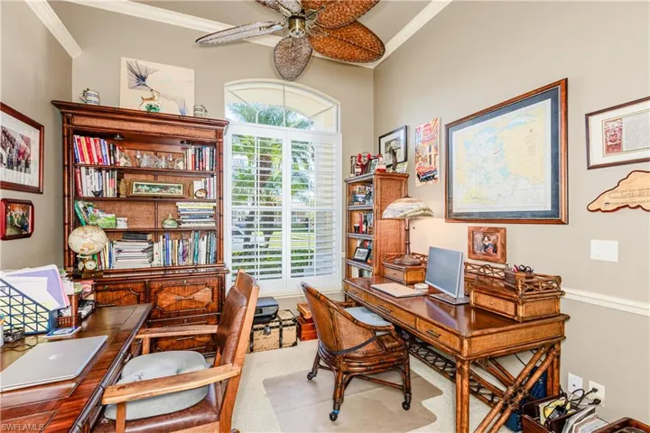 Office space featuring ornamental molding and ceiling fan