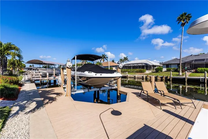 Dock area with a water view and boat lift