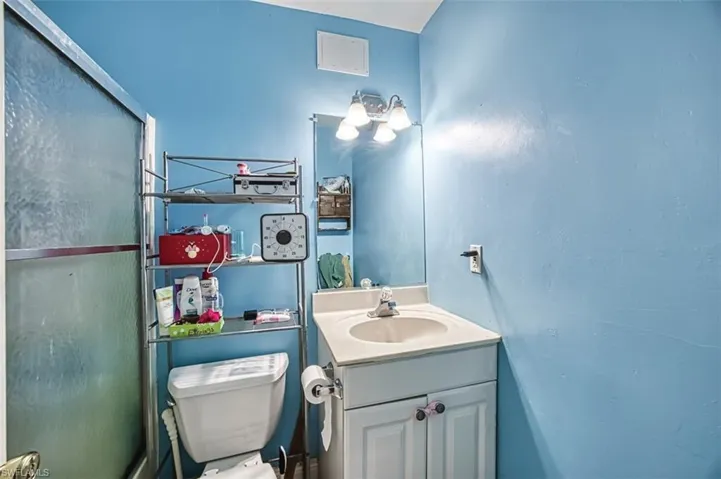 Bathroom featuring toilet and vanity