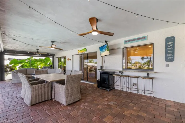 View of patio / terrace featuring ceiling fan and outdoor dining space