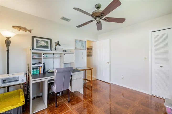 Office featuring baseboards and a ceiling fan